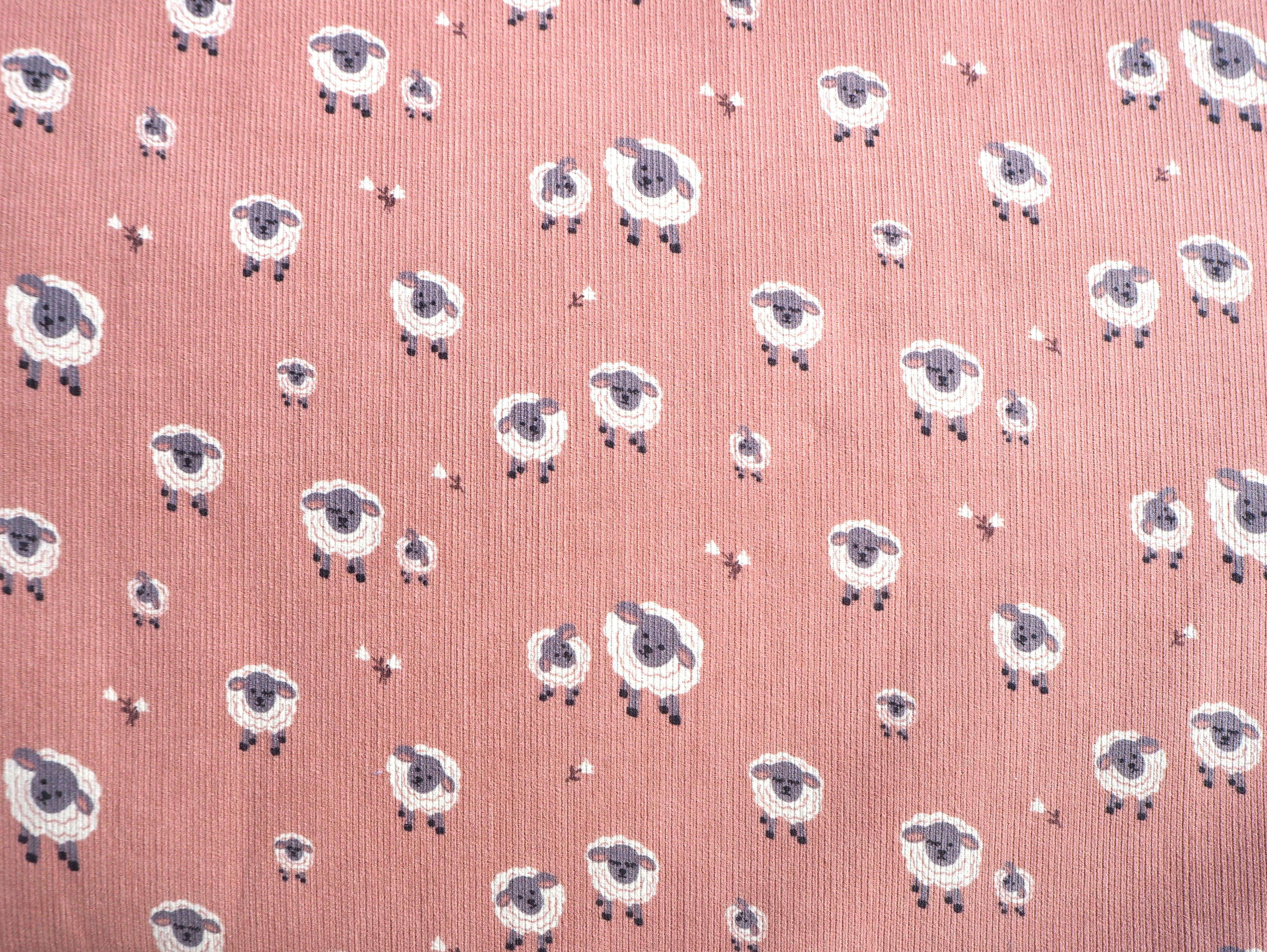 Cute Sheep images on pale pink corduroy fabric
