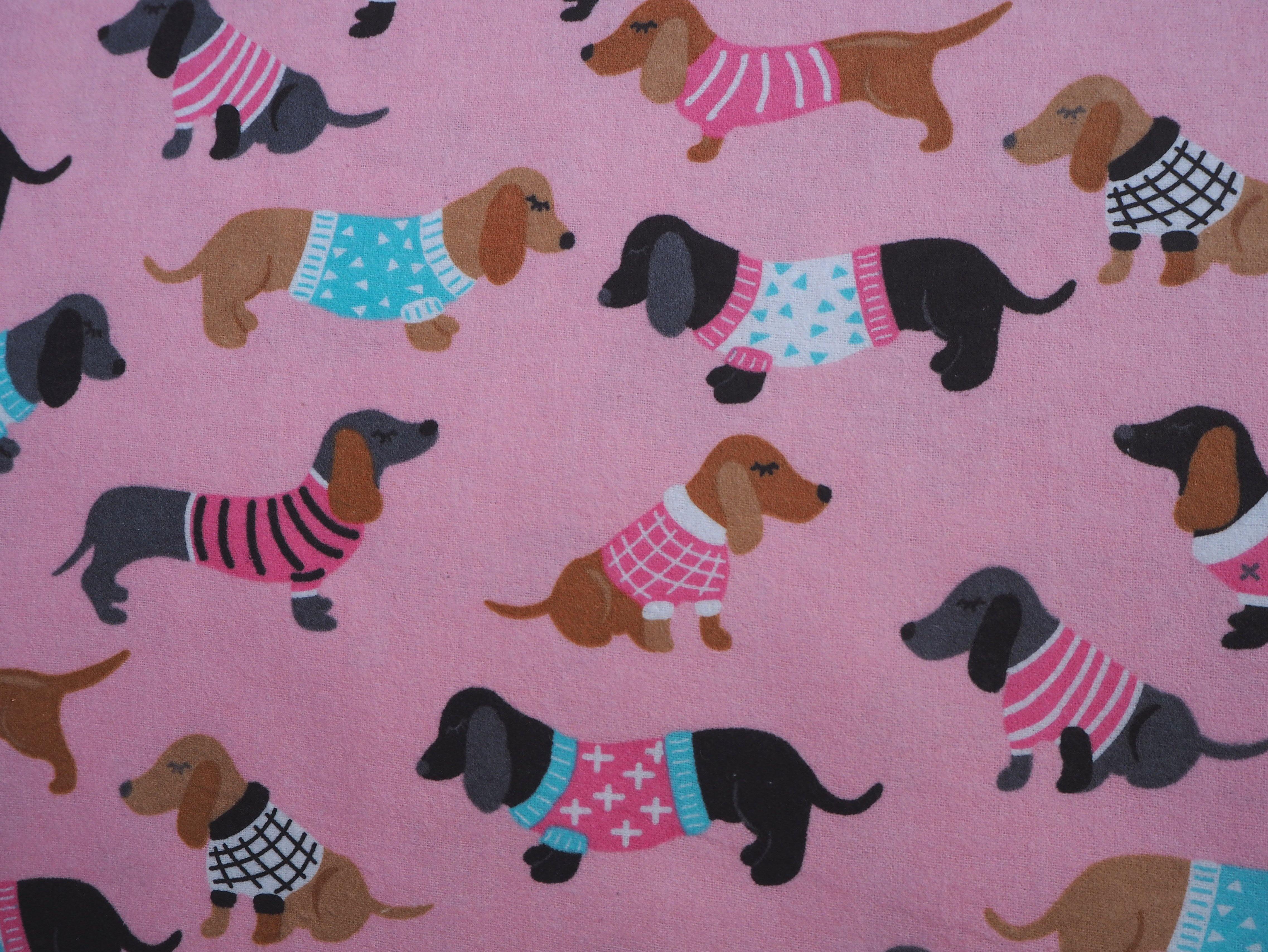 Dogs in Cute Jackets on soft pink flannelette 100% cotton fabric
