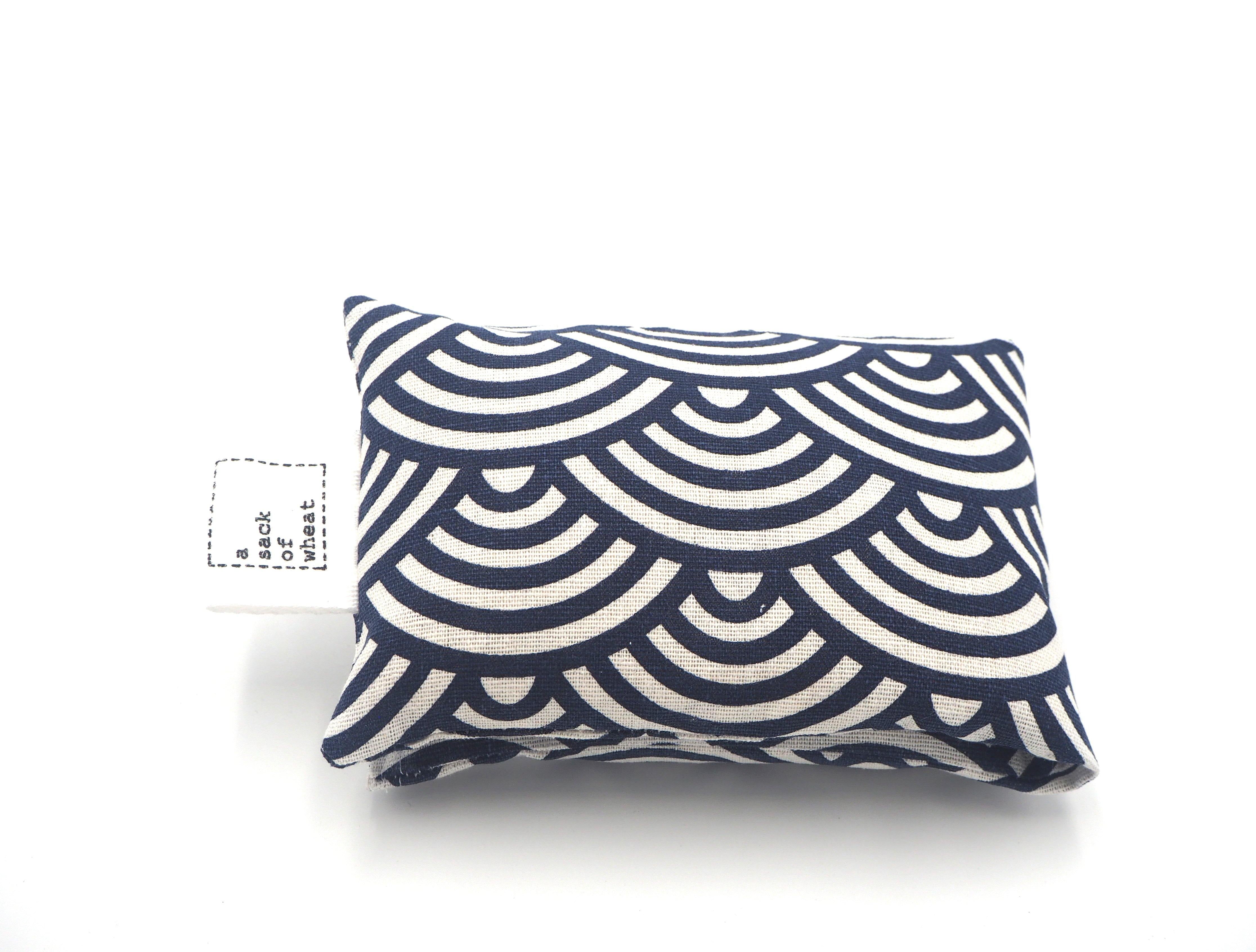Folded view of A Sack Of Wheat, in a Classic Blue and White shell print, 100% cotton linen fabric