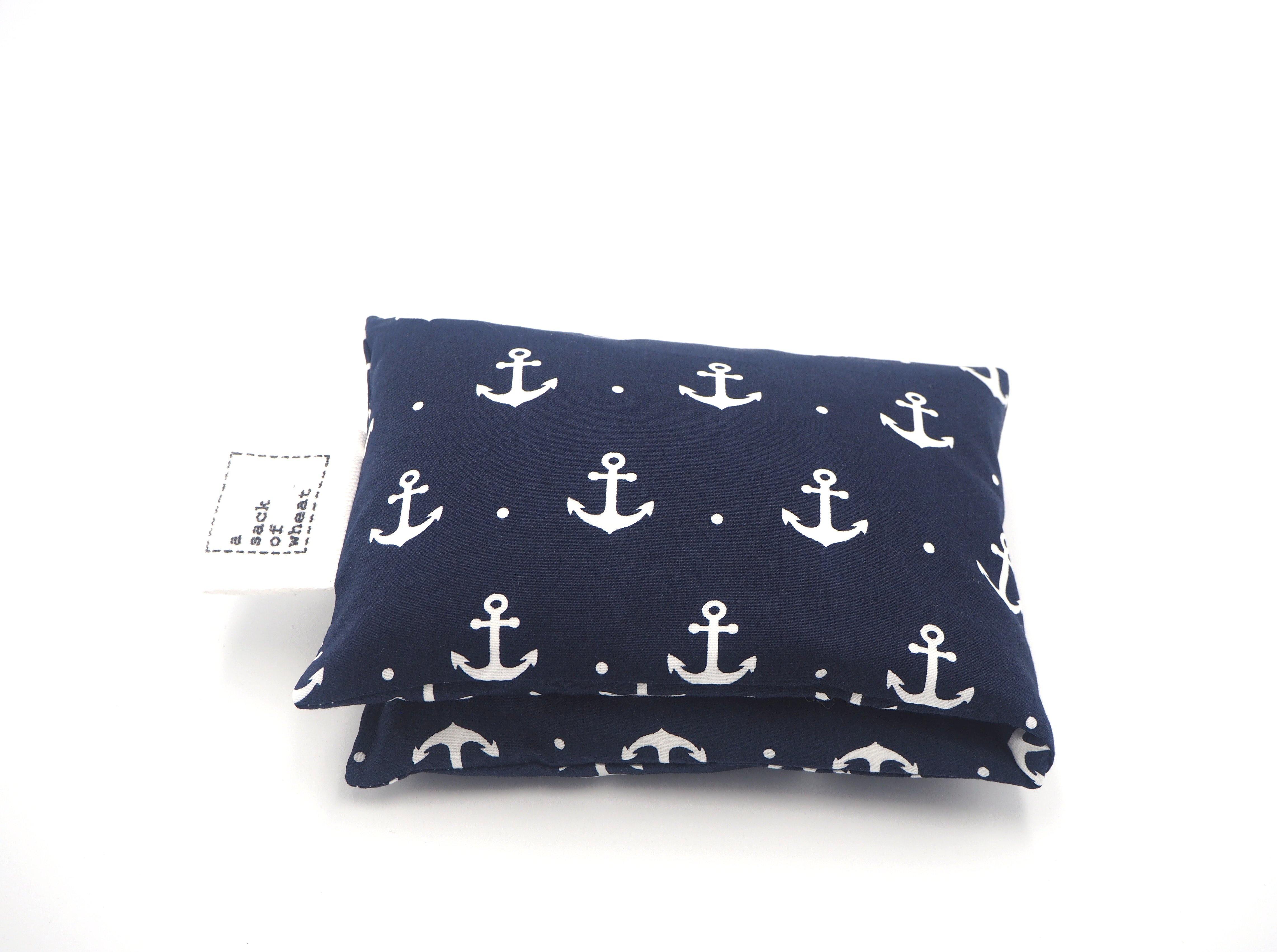 Folded view of A Sack Of Wheat, featuring classic ship anchors on a royal navy blue background, 100% cotton fabric