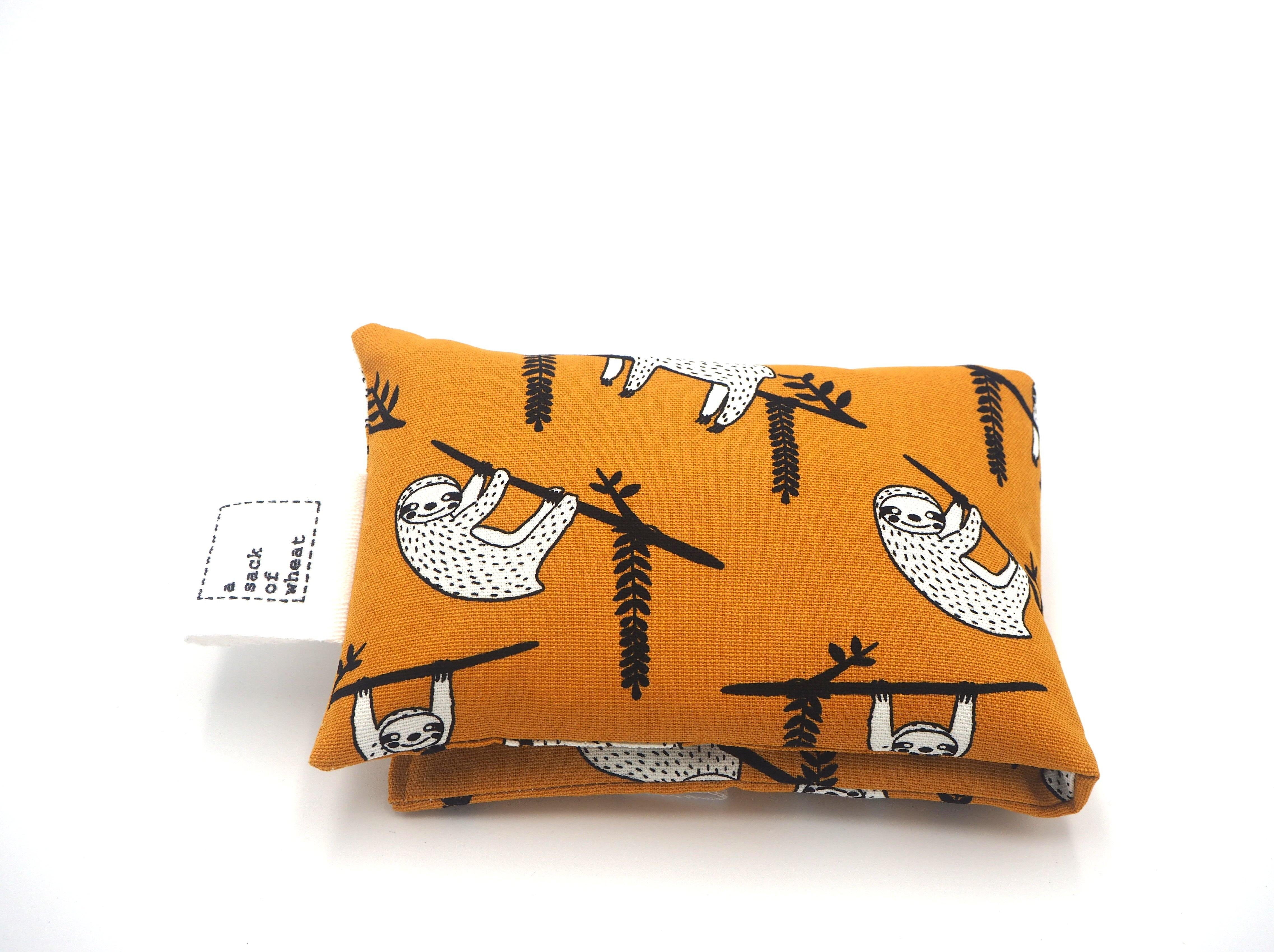 Folded view of A Sack Of Wheat, featuring Hanging Around Sloth print, 100% cotton fabric