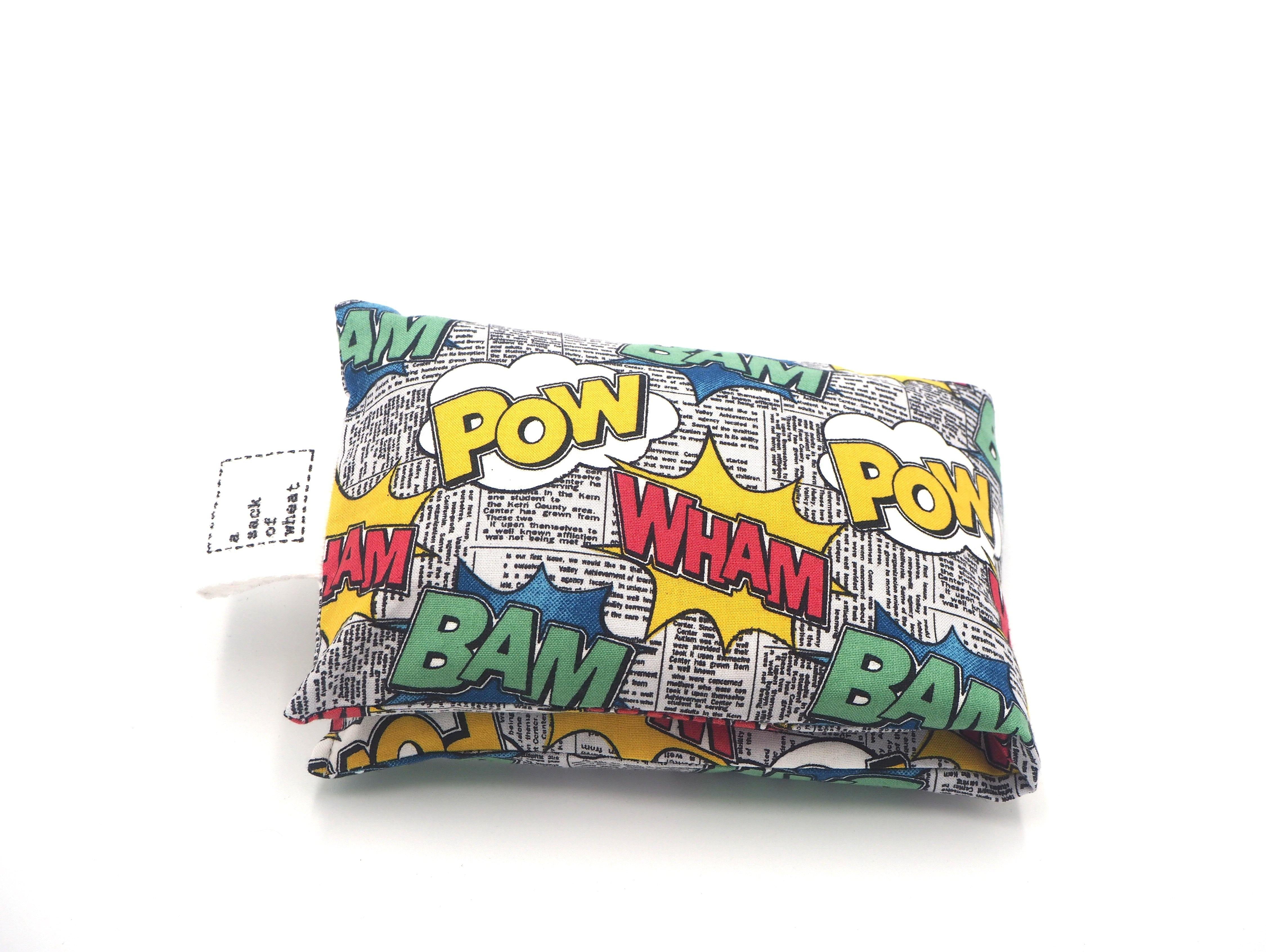 Folded view of A Sack Of Wheat, featuring Wham! Bam! Pow! - Action Words on Newspaper Print themed 100% cotton fabric