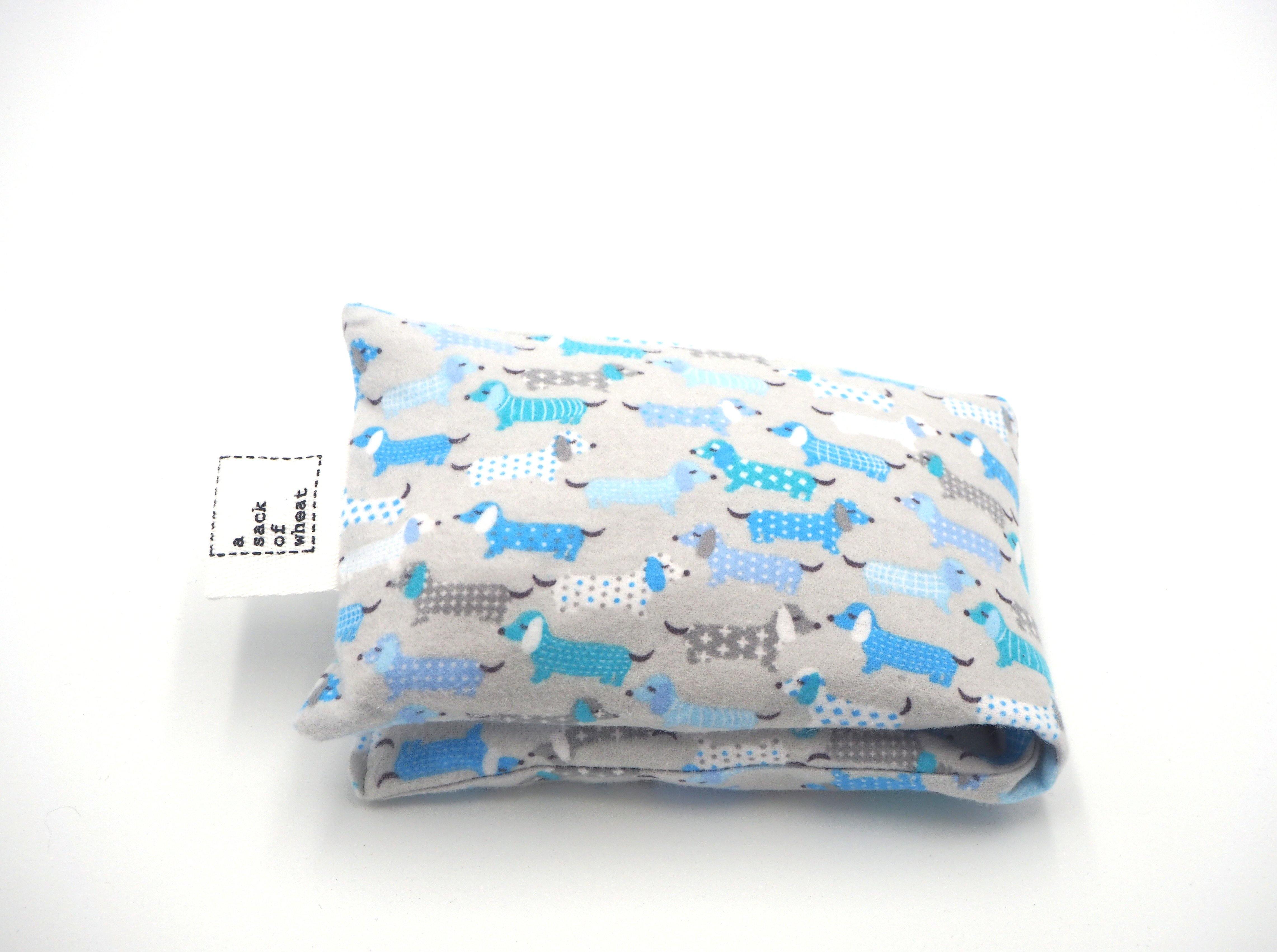 Folded view, of A Sack Of Wheat, PJ Puppy print of soft baby blue flannelette cotton fabric
