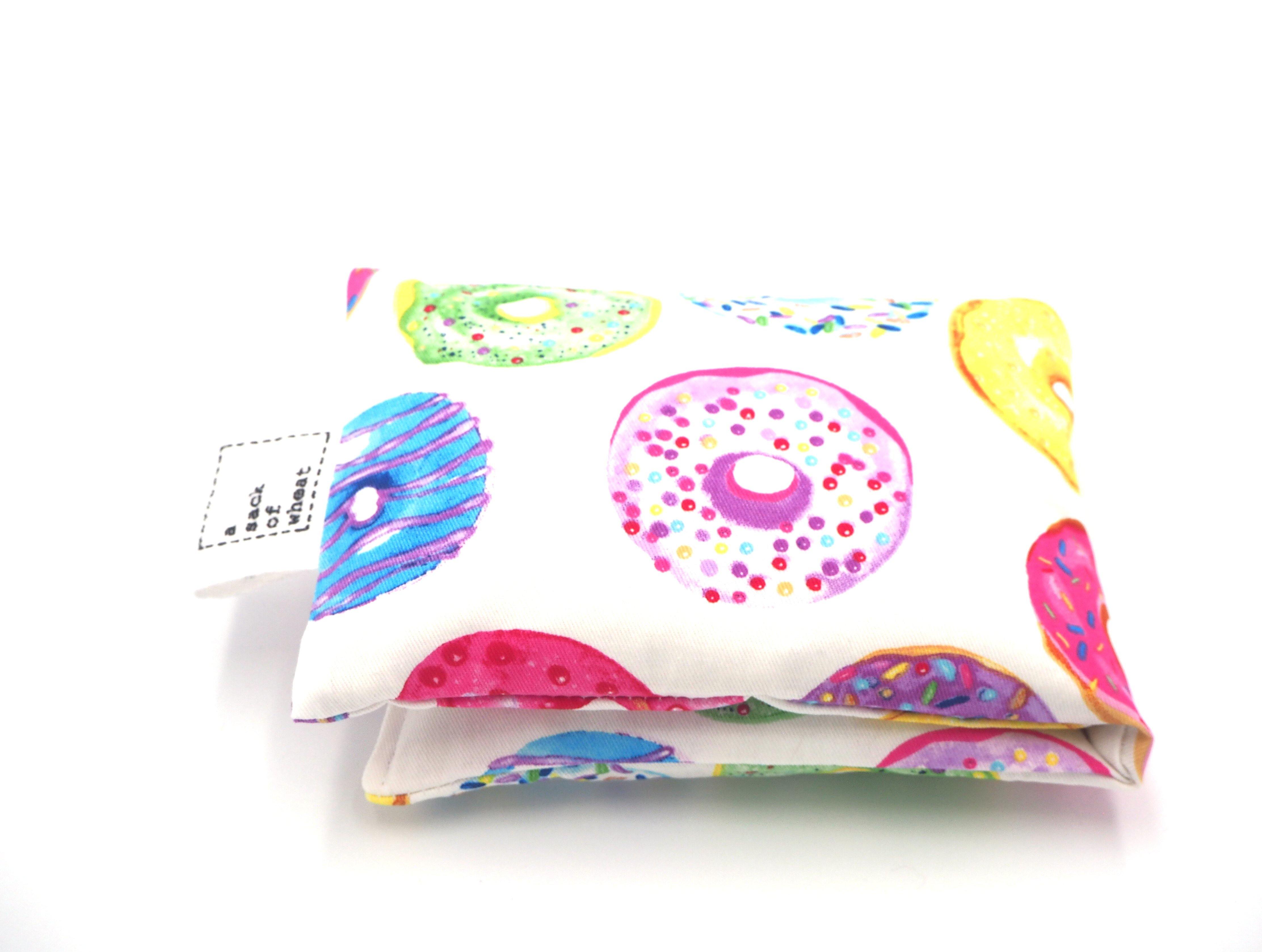 Folded view of A Sack Of Wheat, featuring delicious & colorful Donut images, 100% cotton fabric