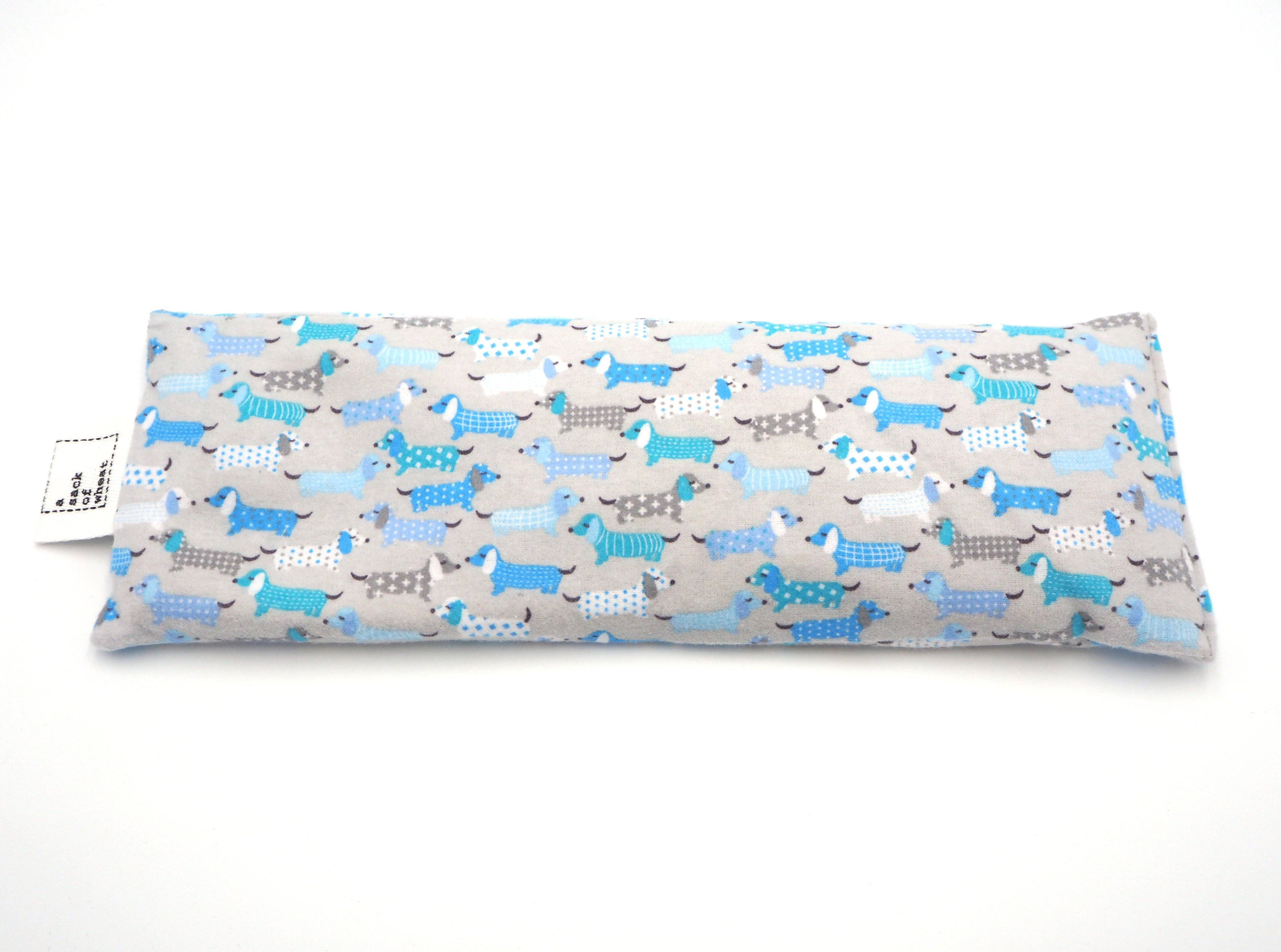 A Sack Of Wheat, flat view of cute puppy's in PJ's on baby blue flannelette cotton fabric