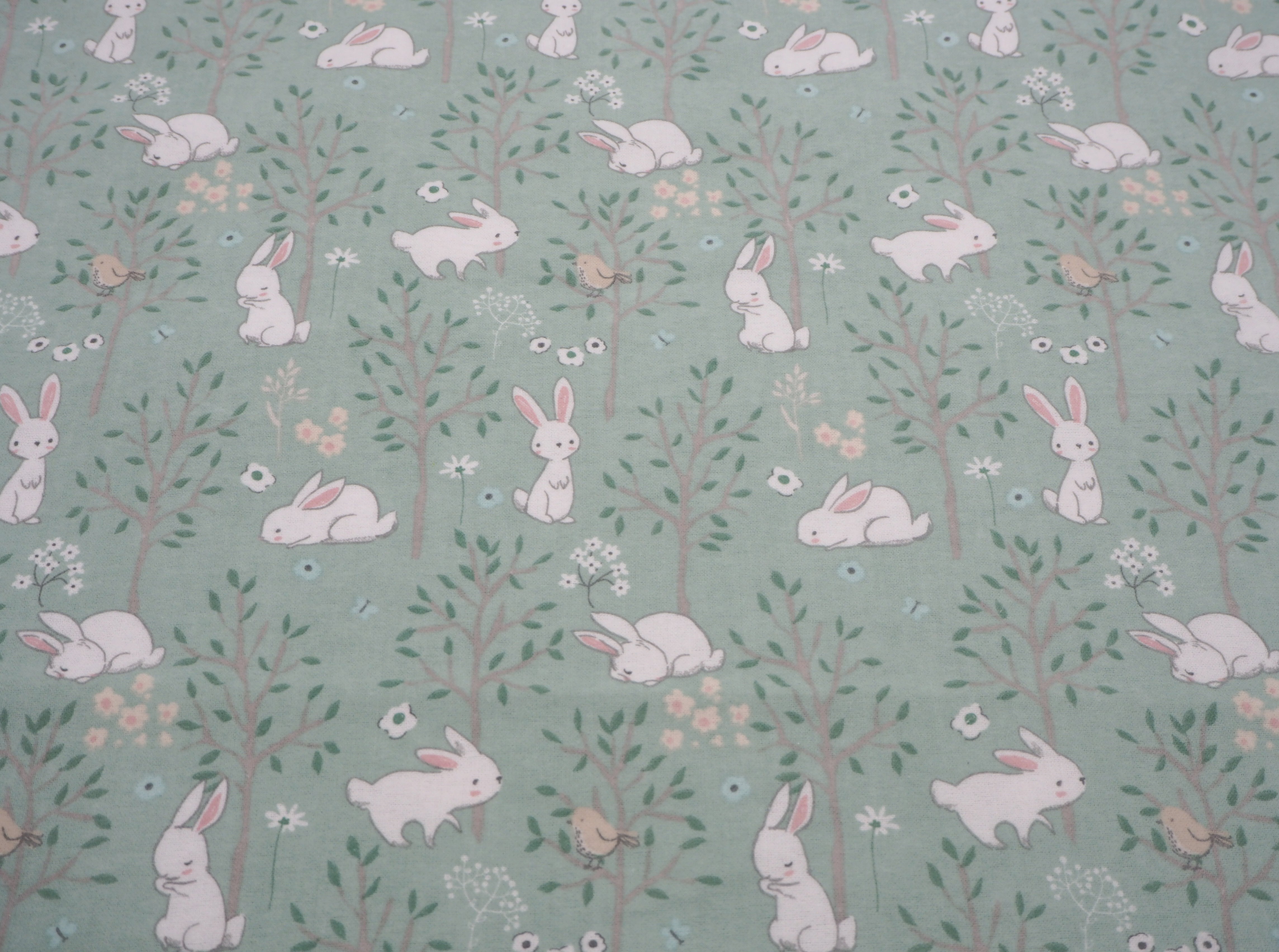 Fabric view, featuring soft & fluffy rabbits & birds on flannelette, 100% cotton fabric