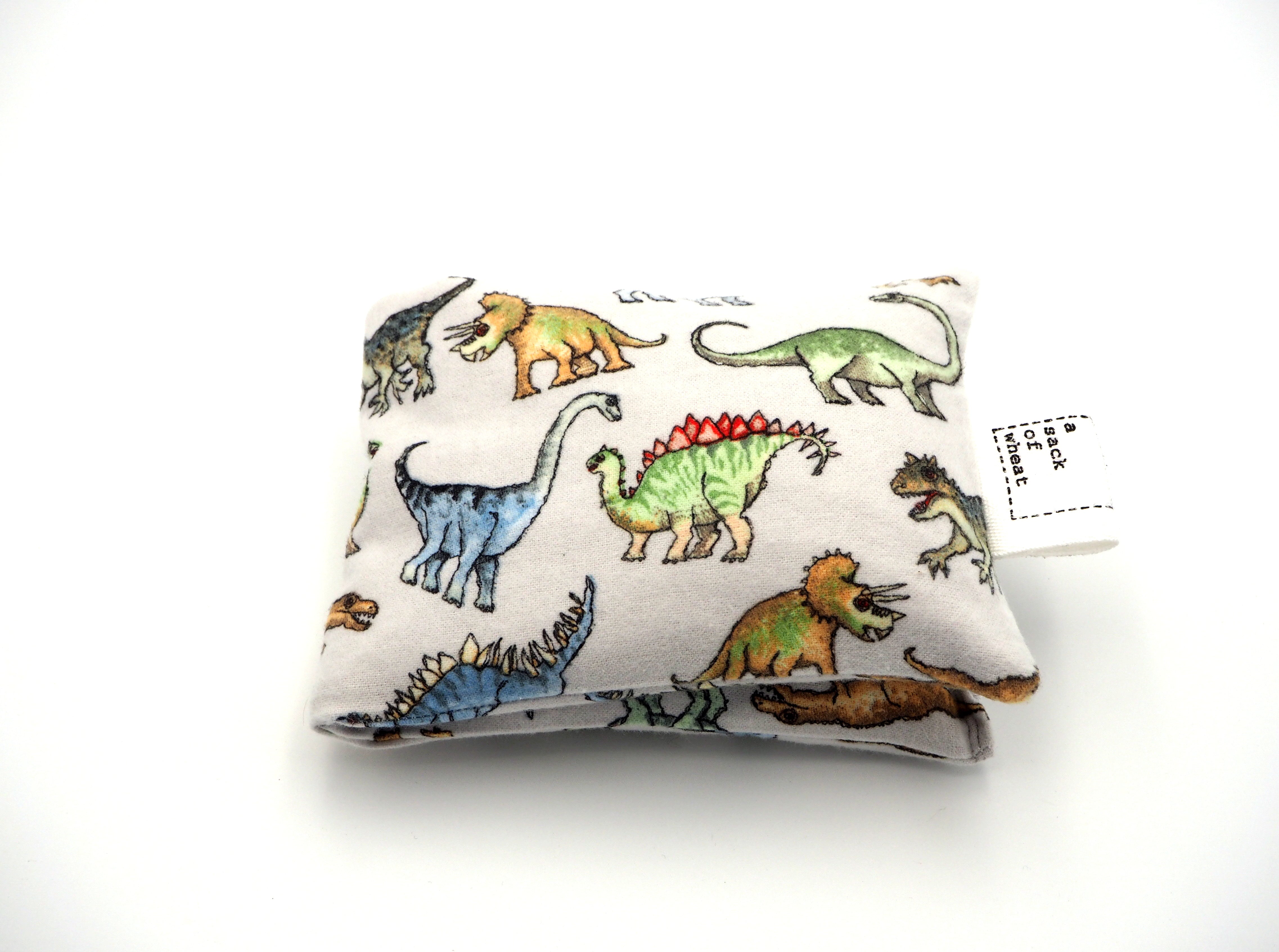 Folded view of A Sack Of Wheat, featuring colorful dinosaurs on 100% cotton flannelette fabric