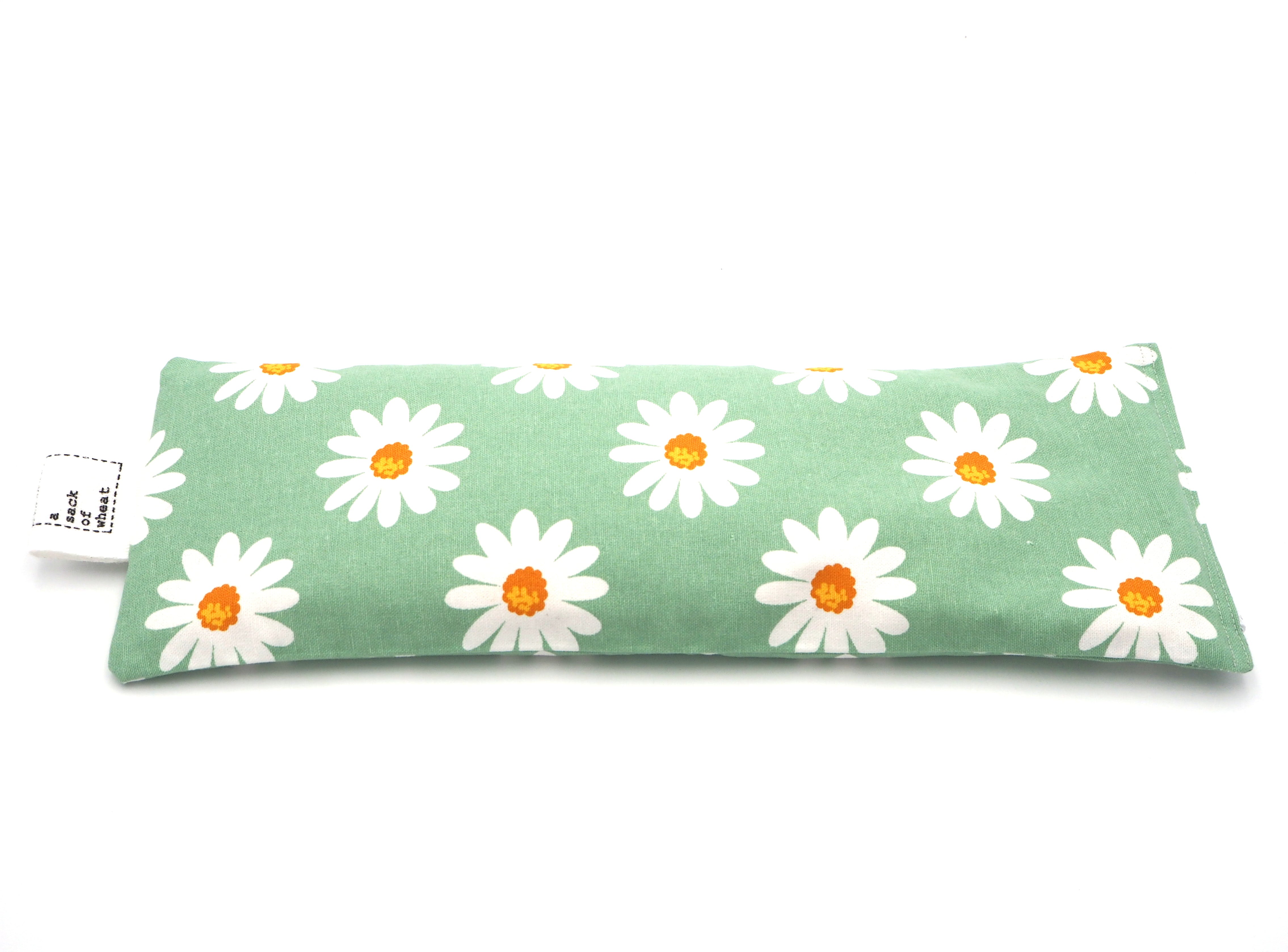 Flat view of A Sack Of Wheat, featuring spring daisy's  on classic vintage green background , 100% cotton fabric