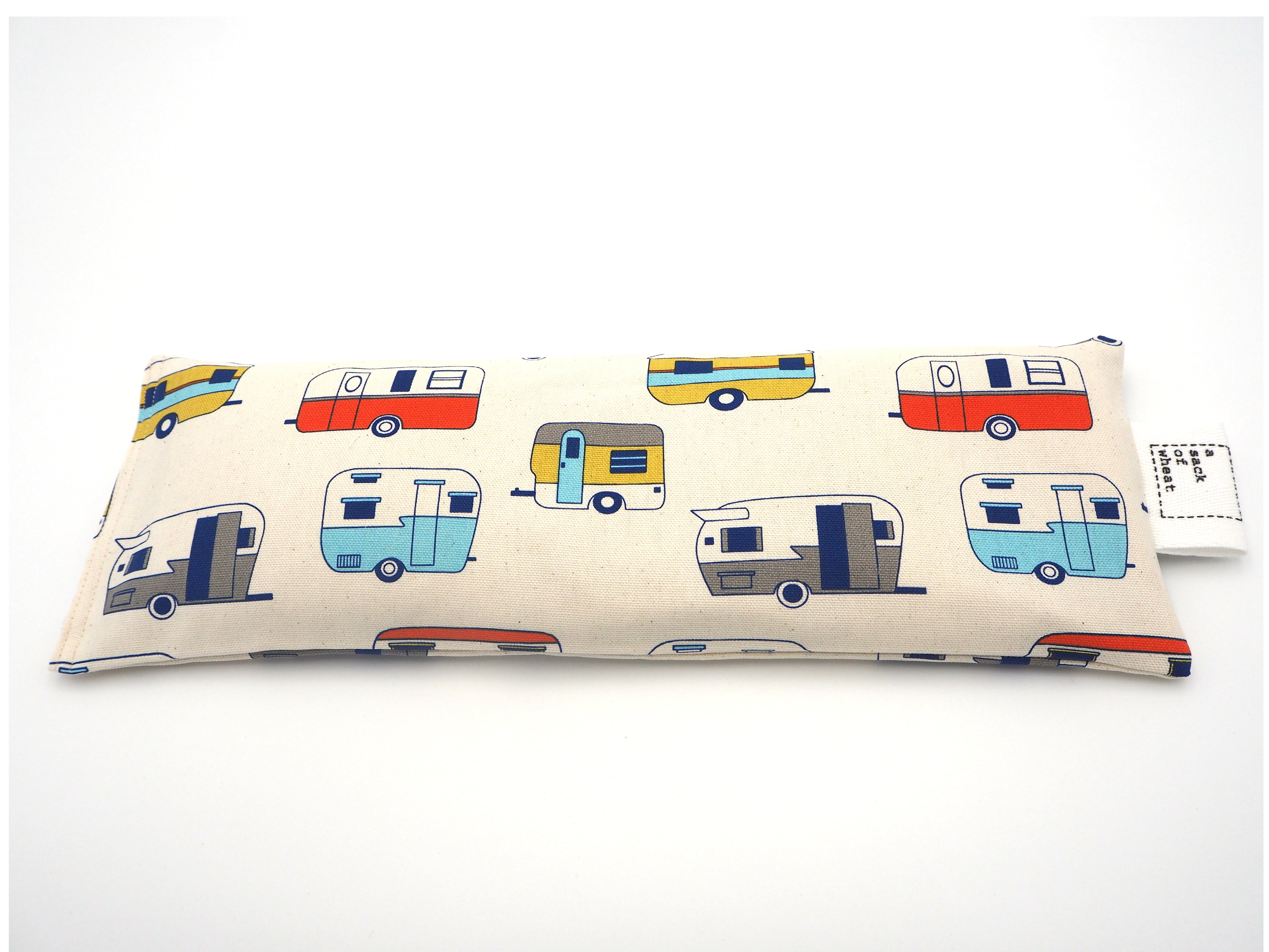 Flat view of A Sack Of Wheat, featuring colorful classic caravans, 100% cotton fabric
