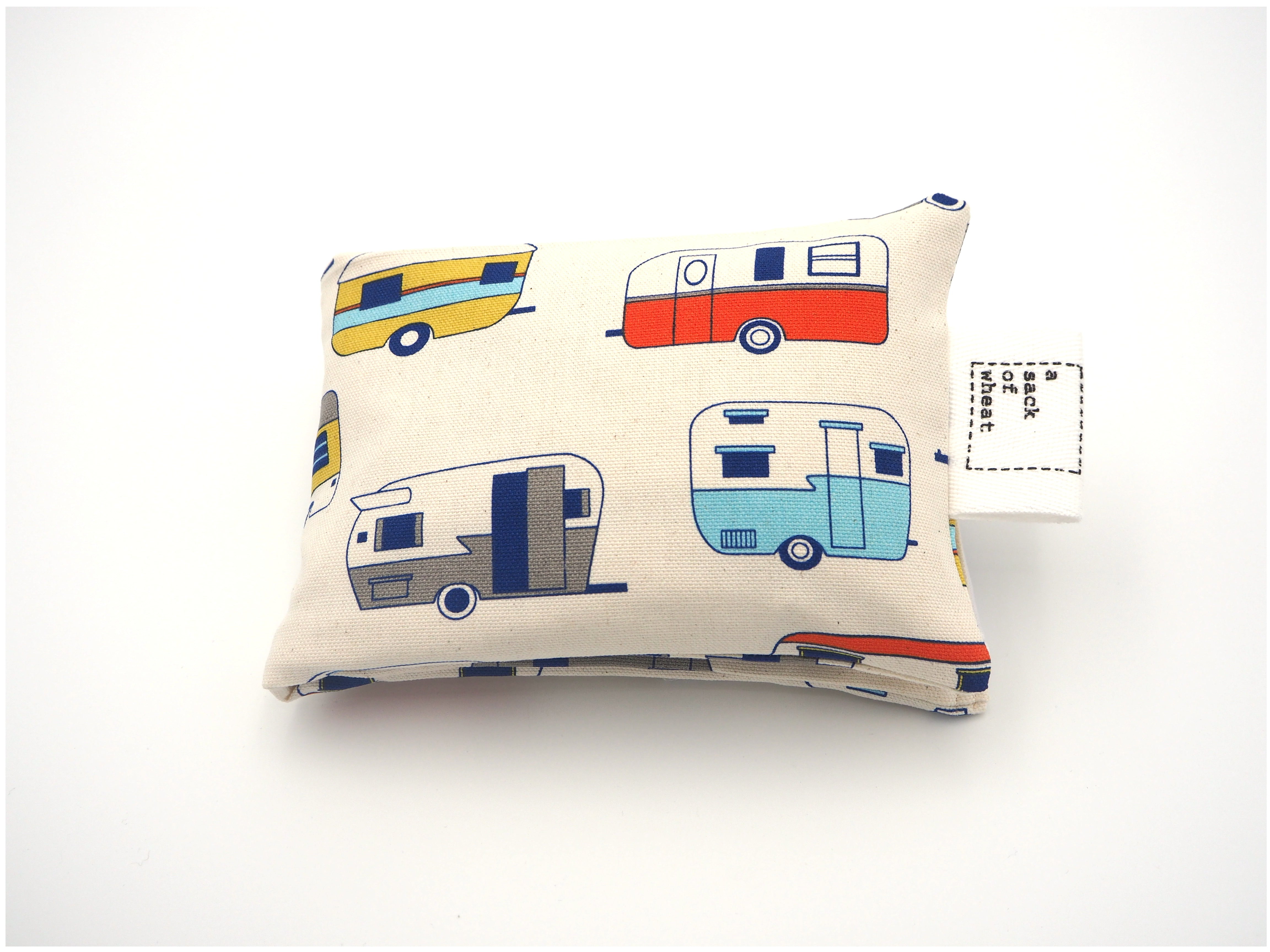 Folded view of A Sack Of Wheat, featuring colorful classic caravans, 100% cotton fabric