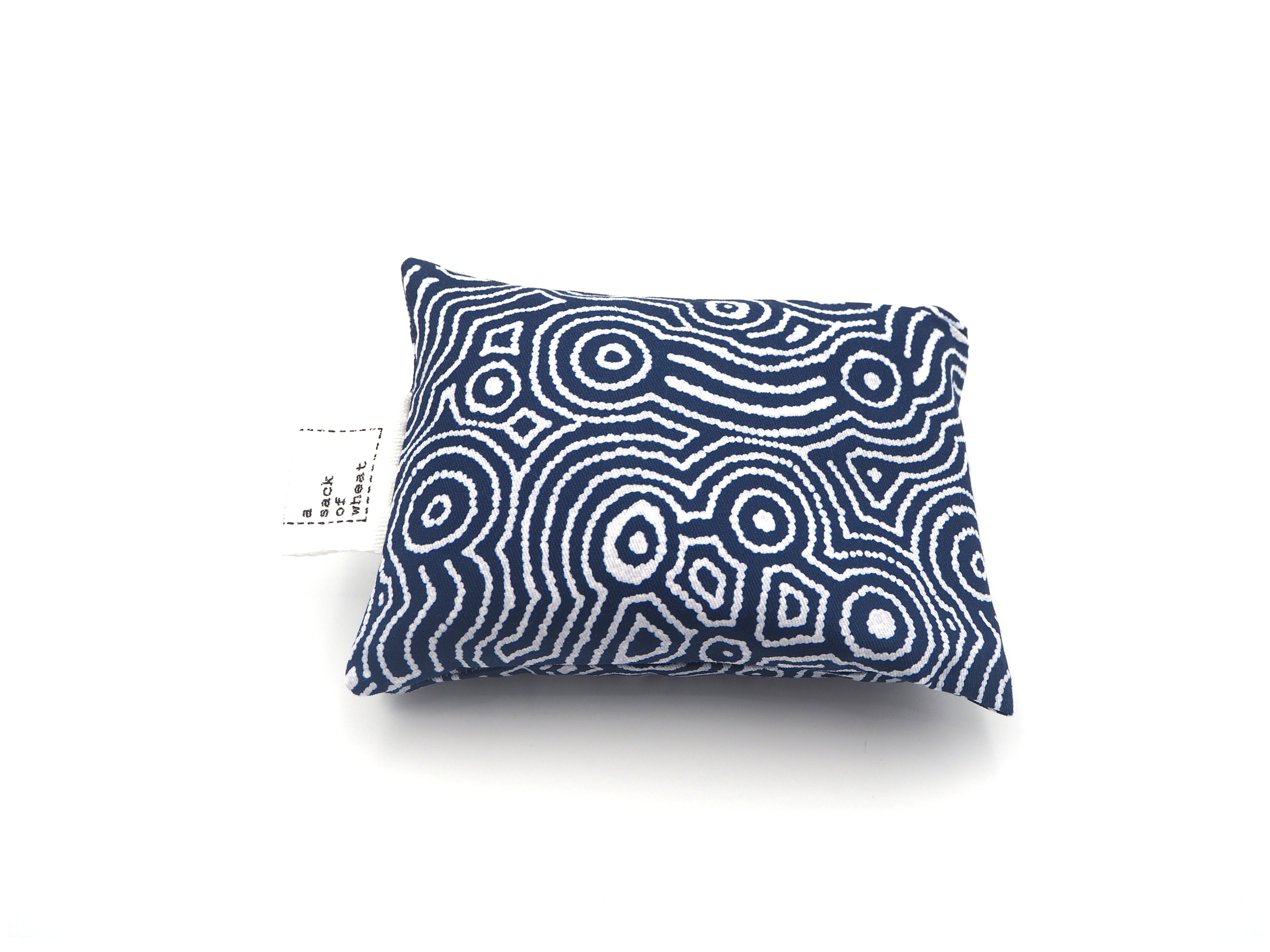 Folded view of A Sack Of Wheat, featuring blue & white dot painting pattern ,100% cotton fabric
