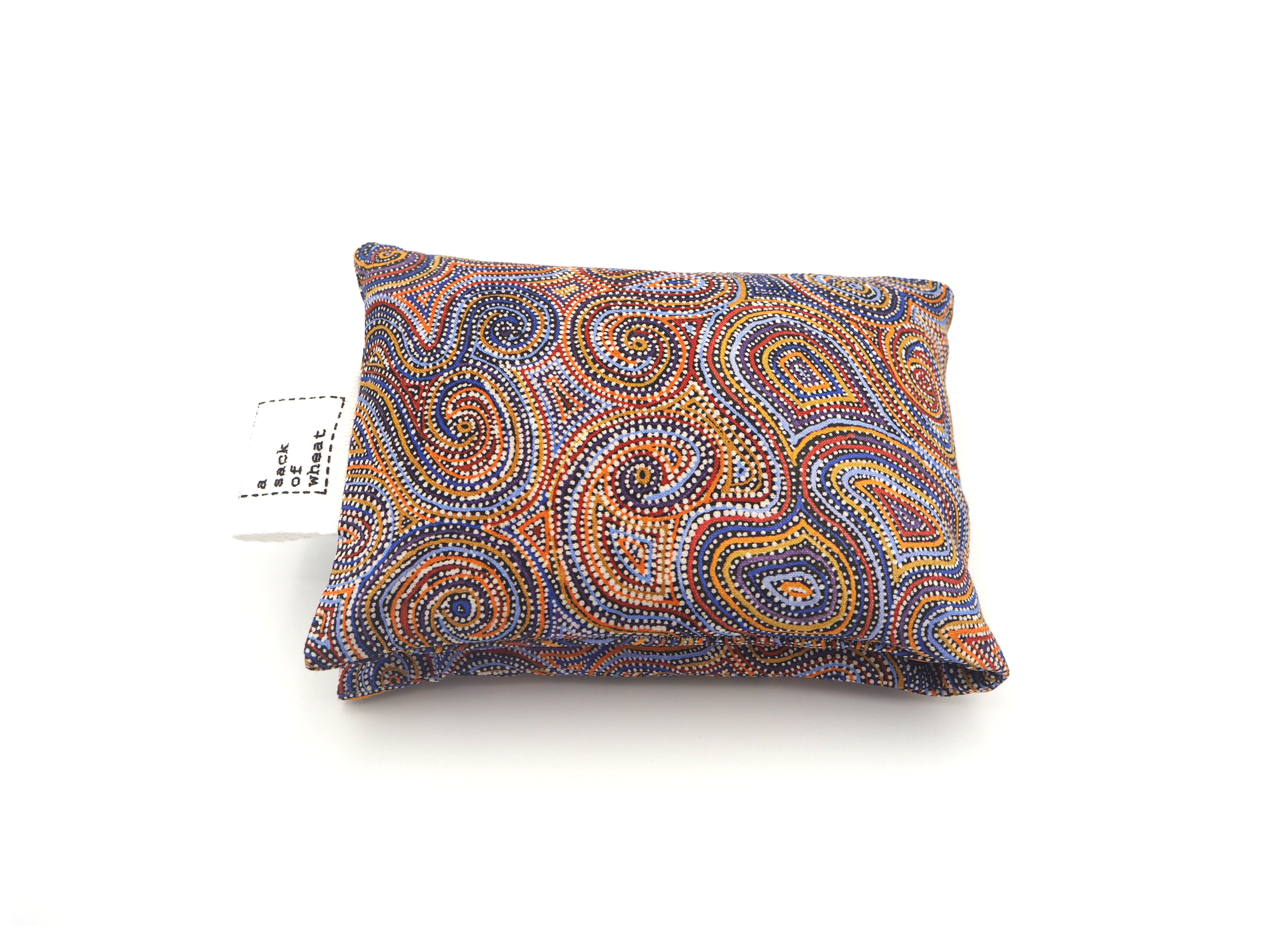 Folded view of A Sack Of Wheat, featuring Mina Mina Dreaming Dot Painting print, 100% cotton fabric
