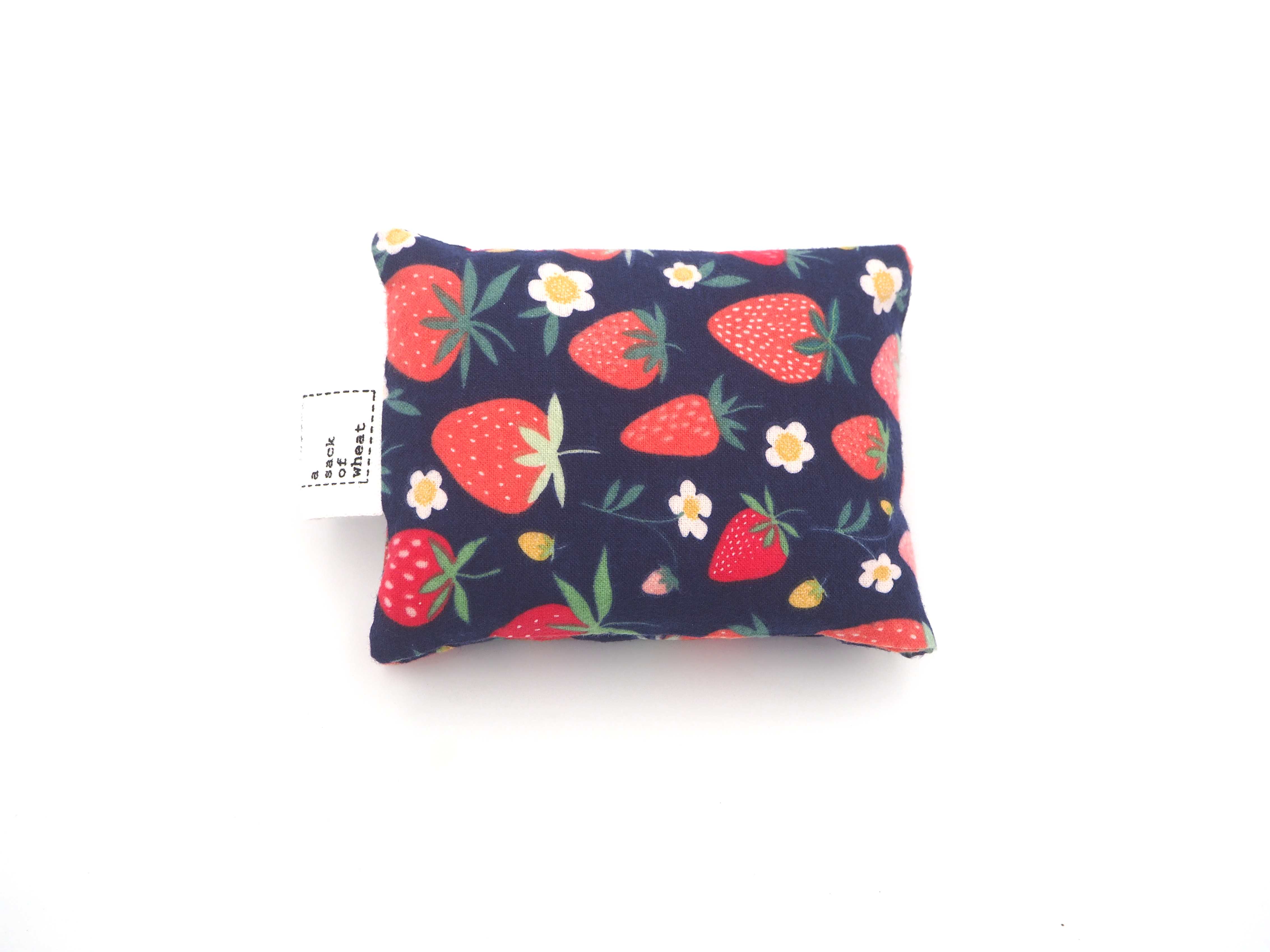 Folded image of strawberry themed wheat bag | 100% cotton fabric