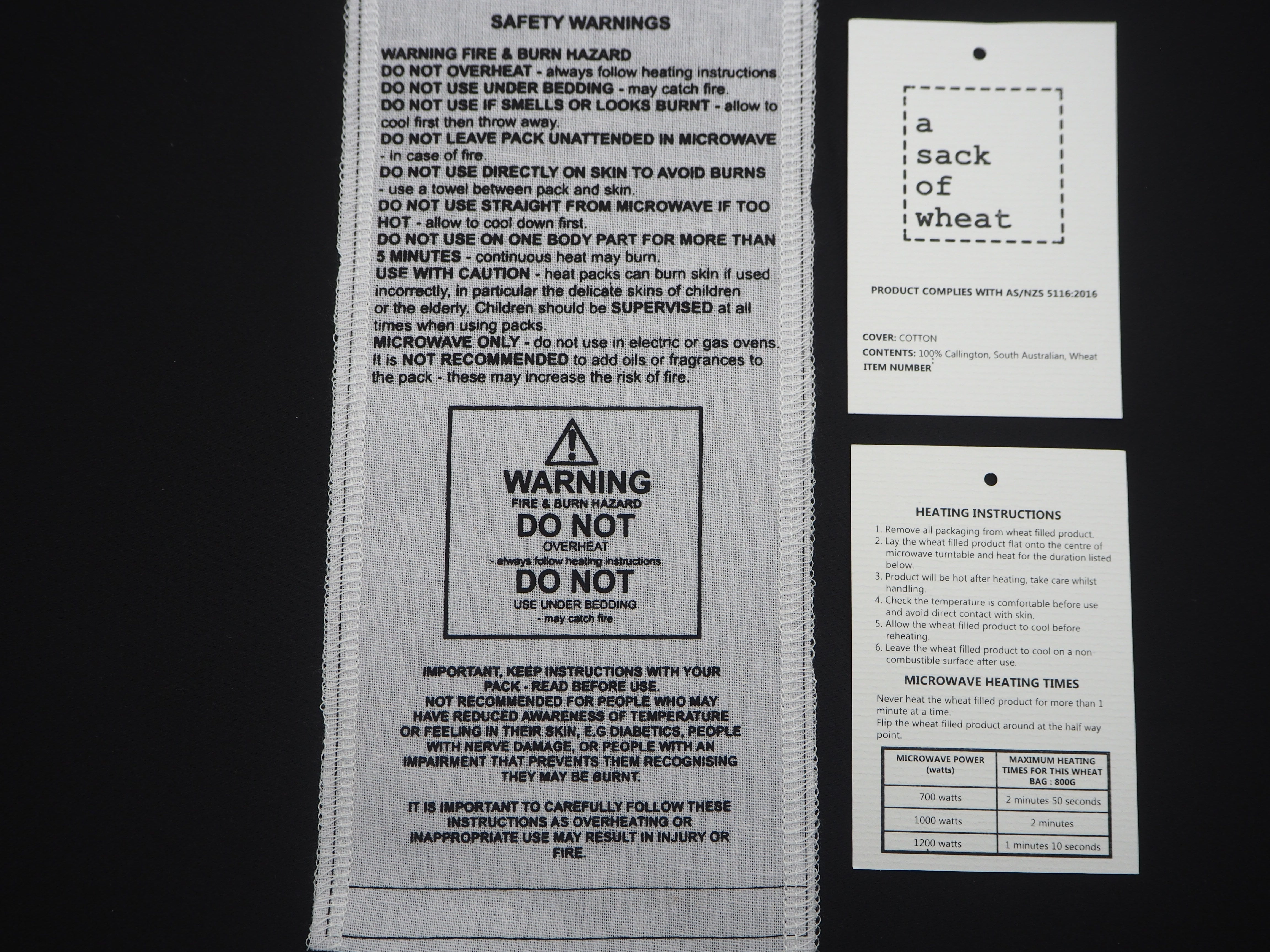 Safety warning labels on a product packaging with text and symbols.