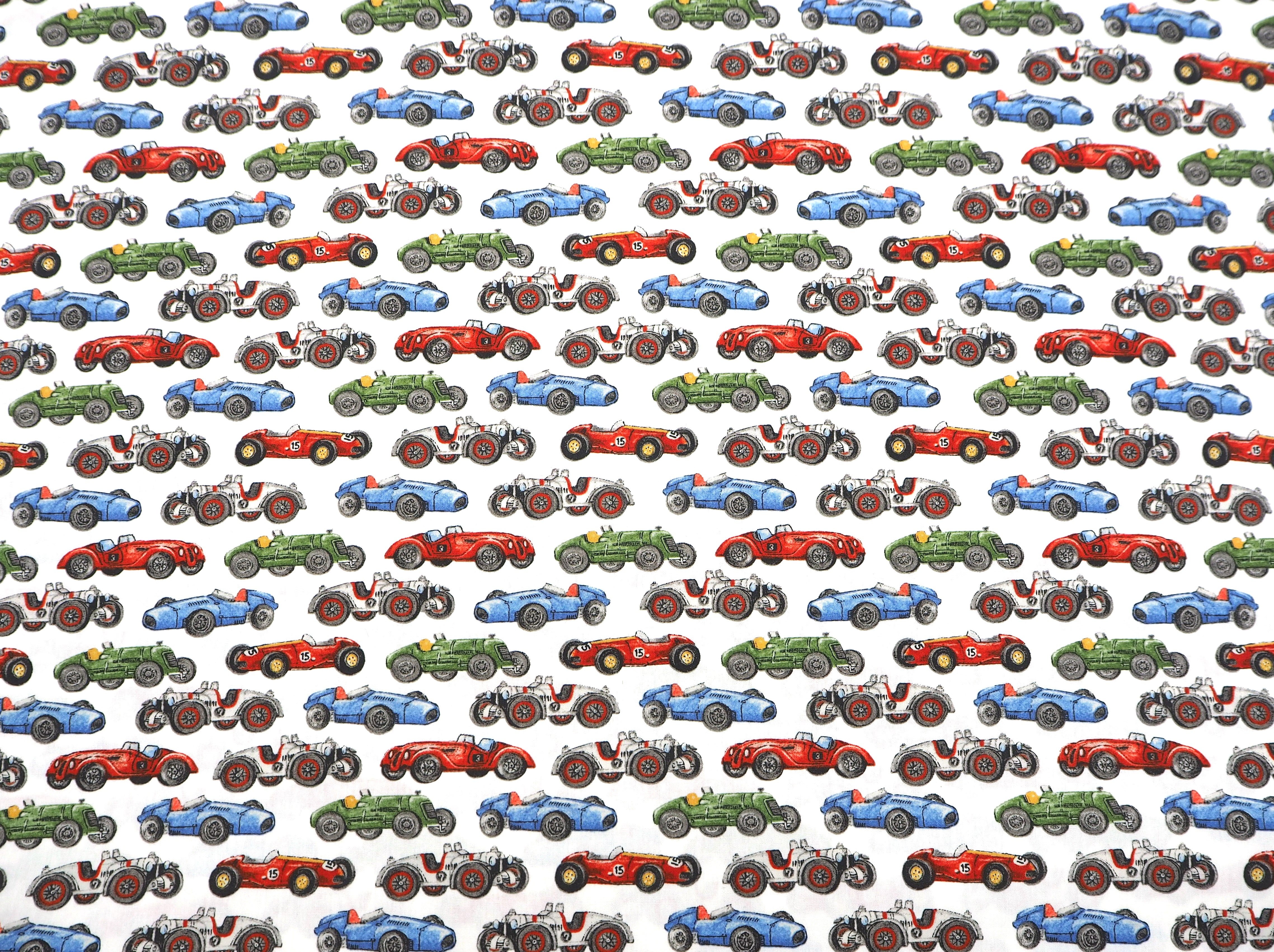 Cotton fabric featuring colorful Vintage racing cars on white background
