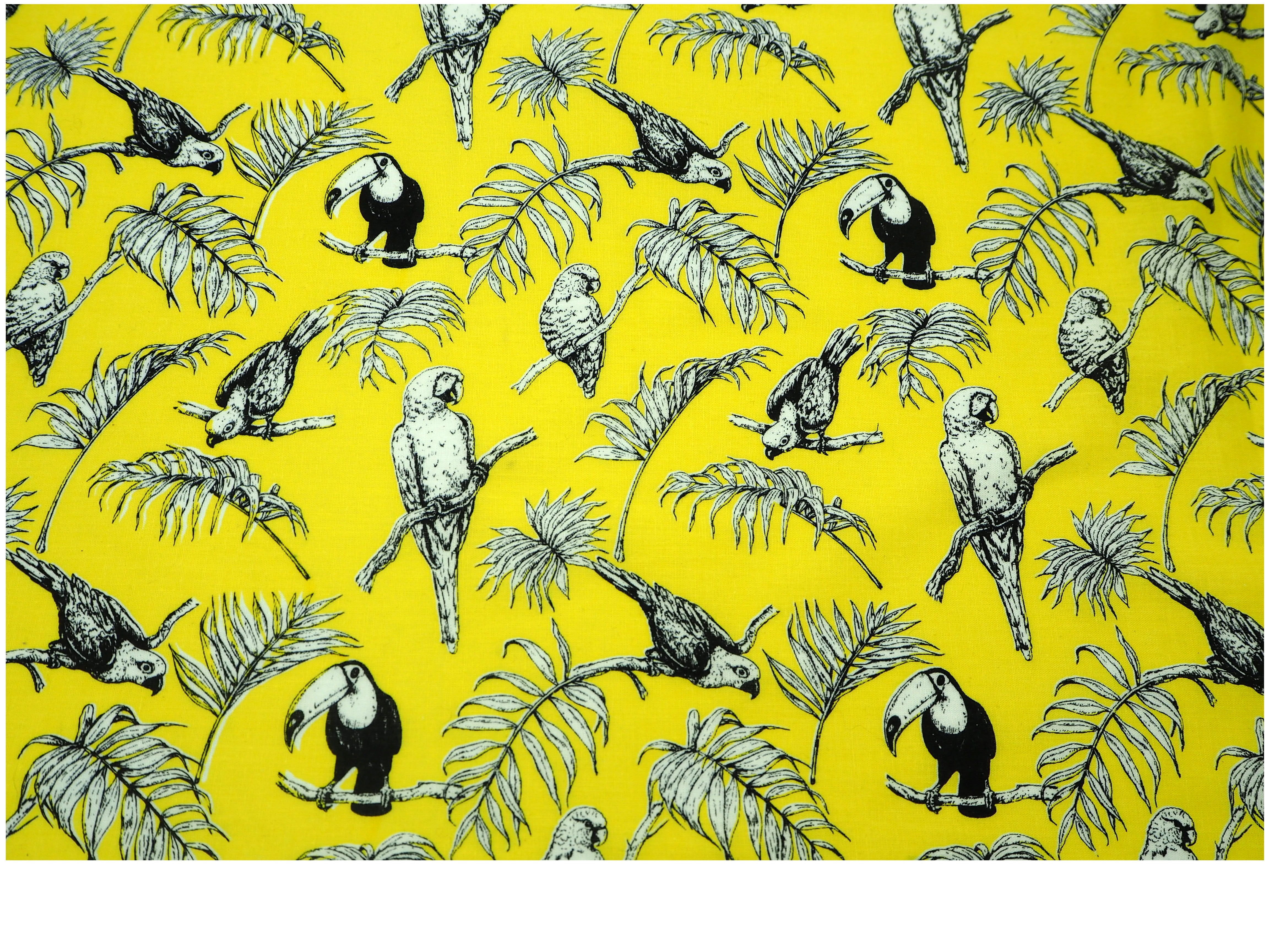 Fabric view of A Sack Of Wheat, featuring Parrots & Toucans on a bright yellow background, 100% cotton fabric