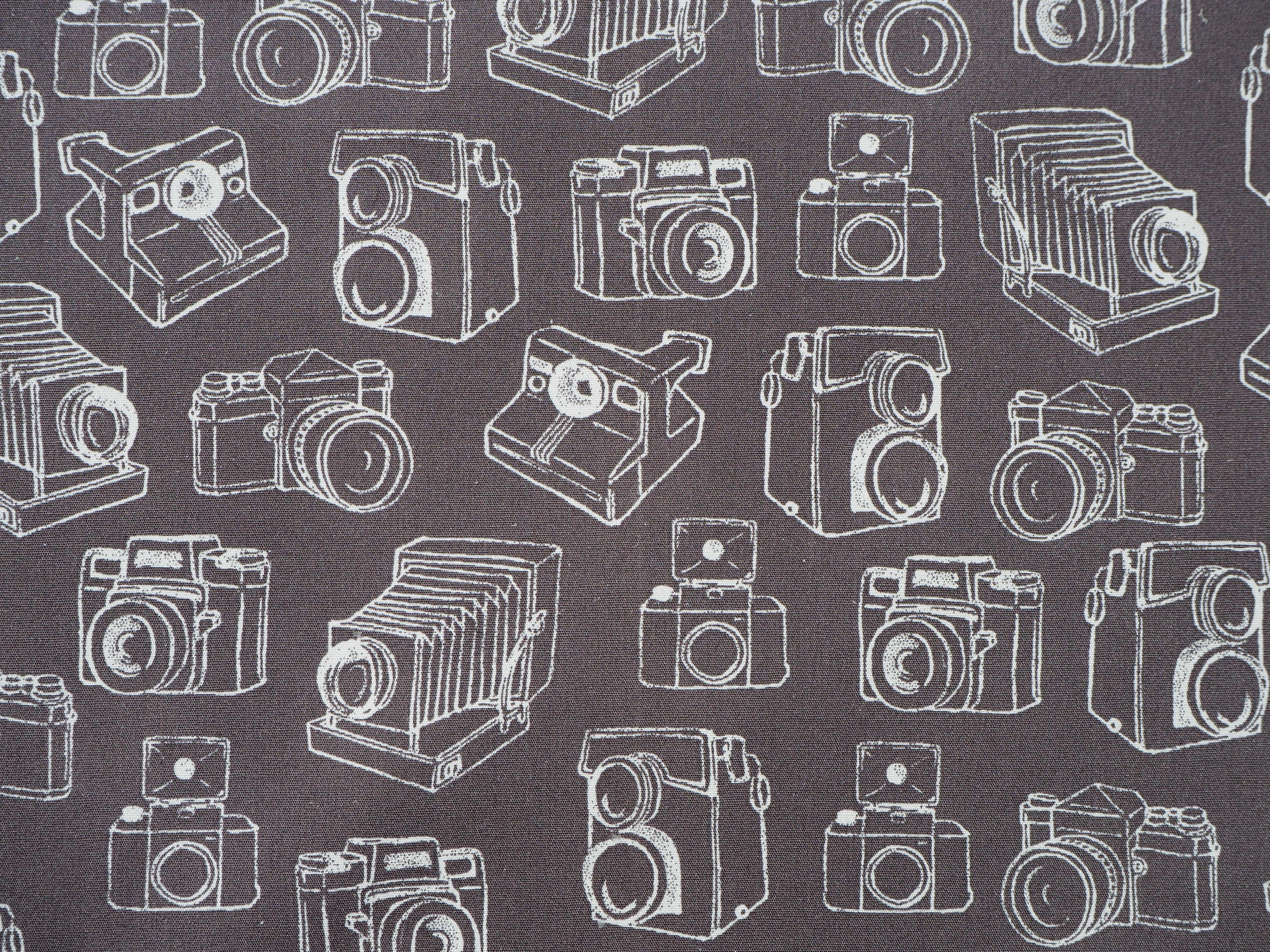 Classic silhouette's of vintage camera images on soft brown, 100% cotton fabric background