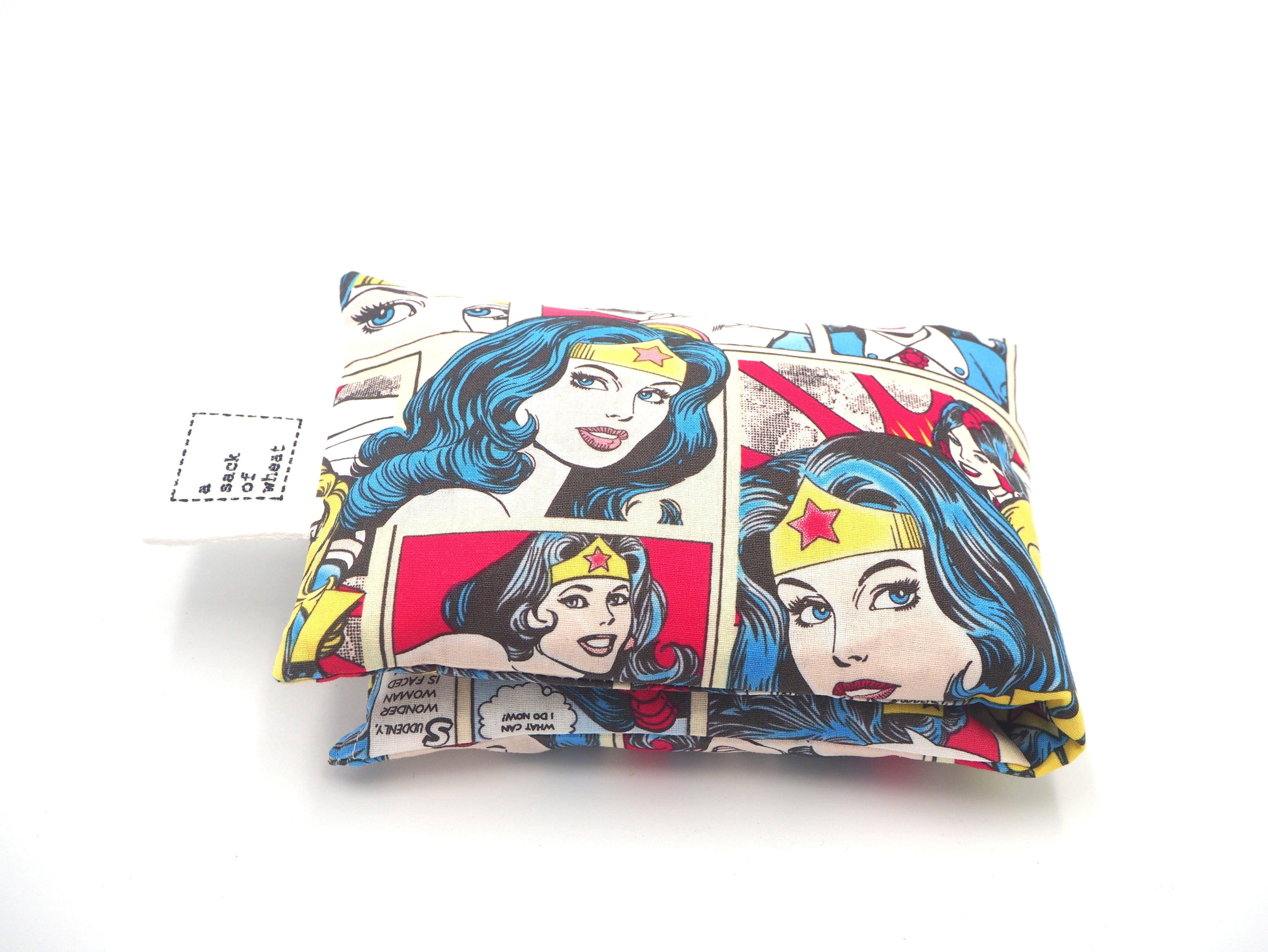 Folded view of A Sack Of Wheat, featuring colorful comic book images, 100% cotton fabric