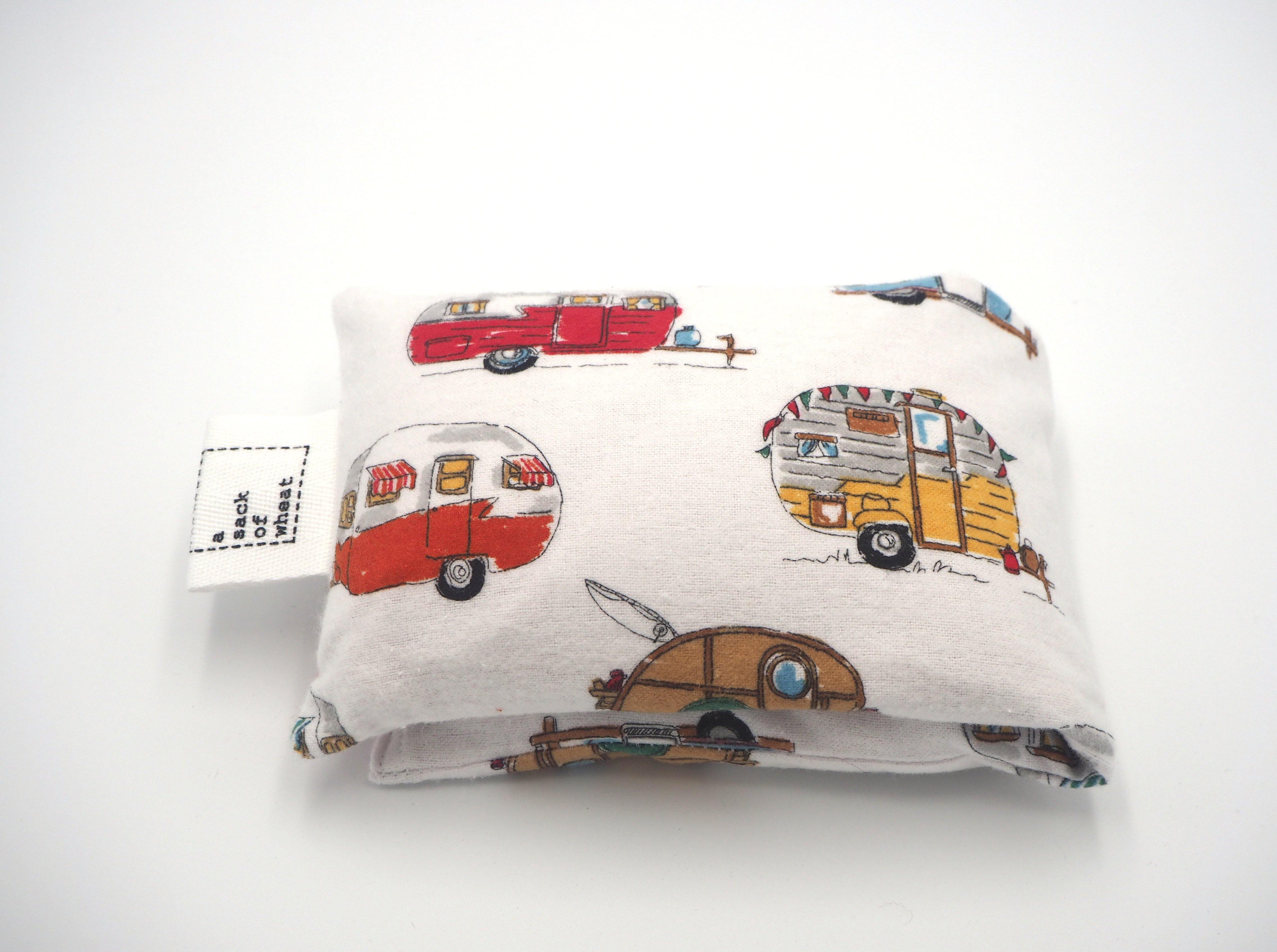 Folded view of A Sack Of Wheat, featuring Retro Caravan print, on soft & fluffy white flannelette 100% cotton fabric