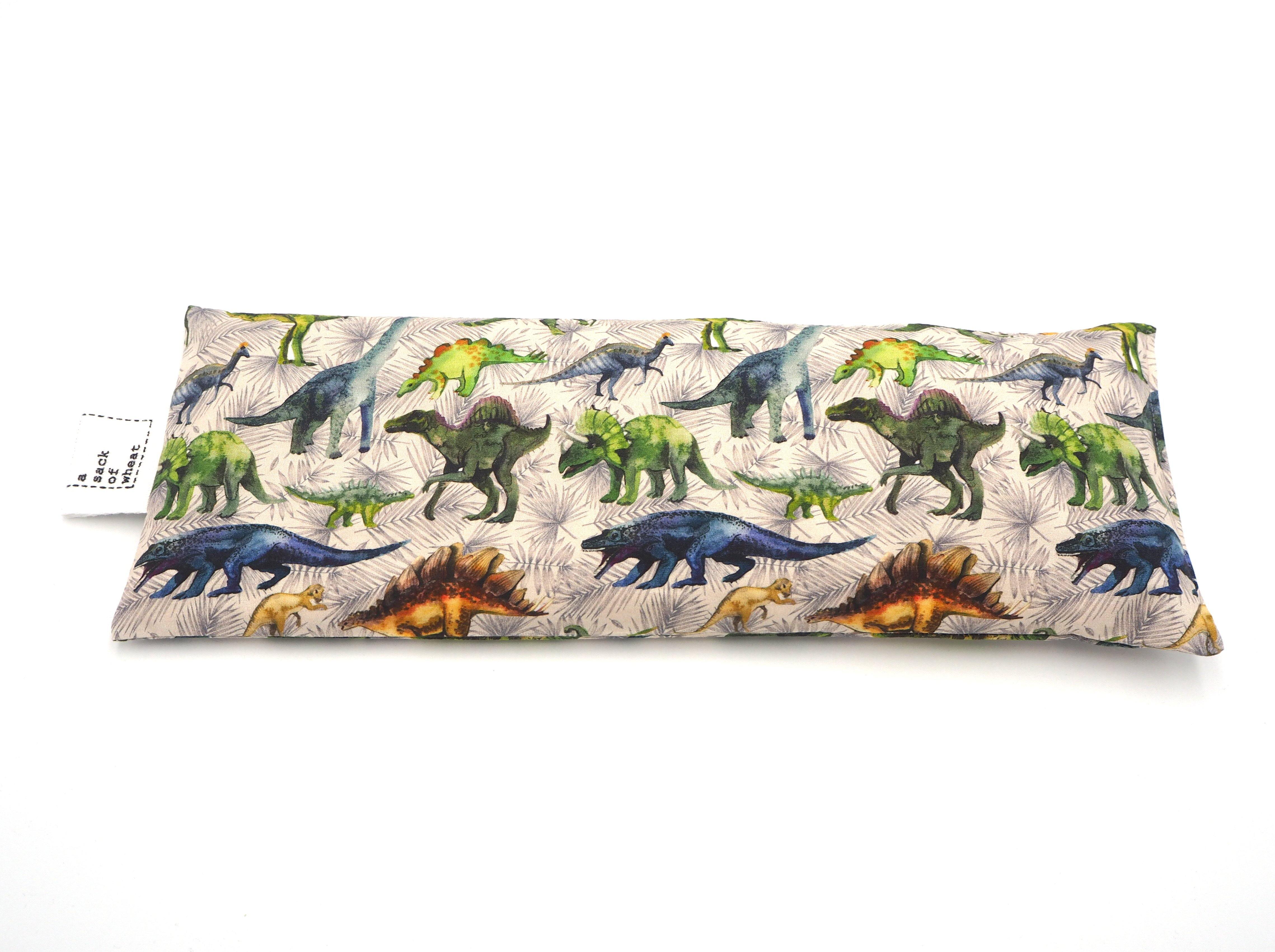 Flat view of A Sack Of Wheat, featuring colorful prehistoric Dinosaur print, 100% cotton fabric