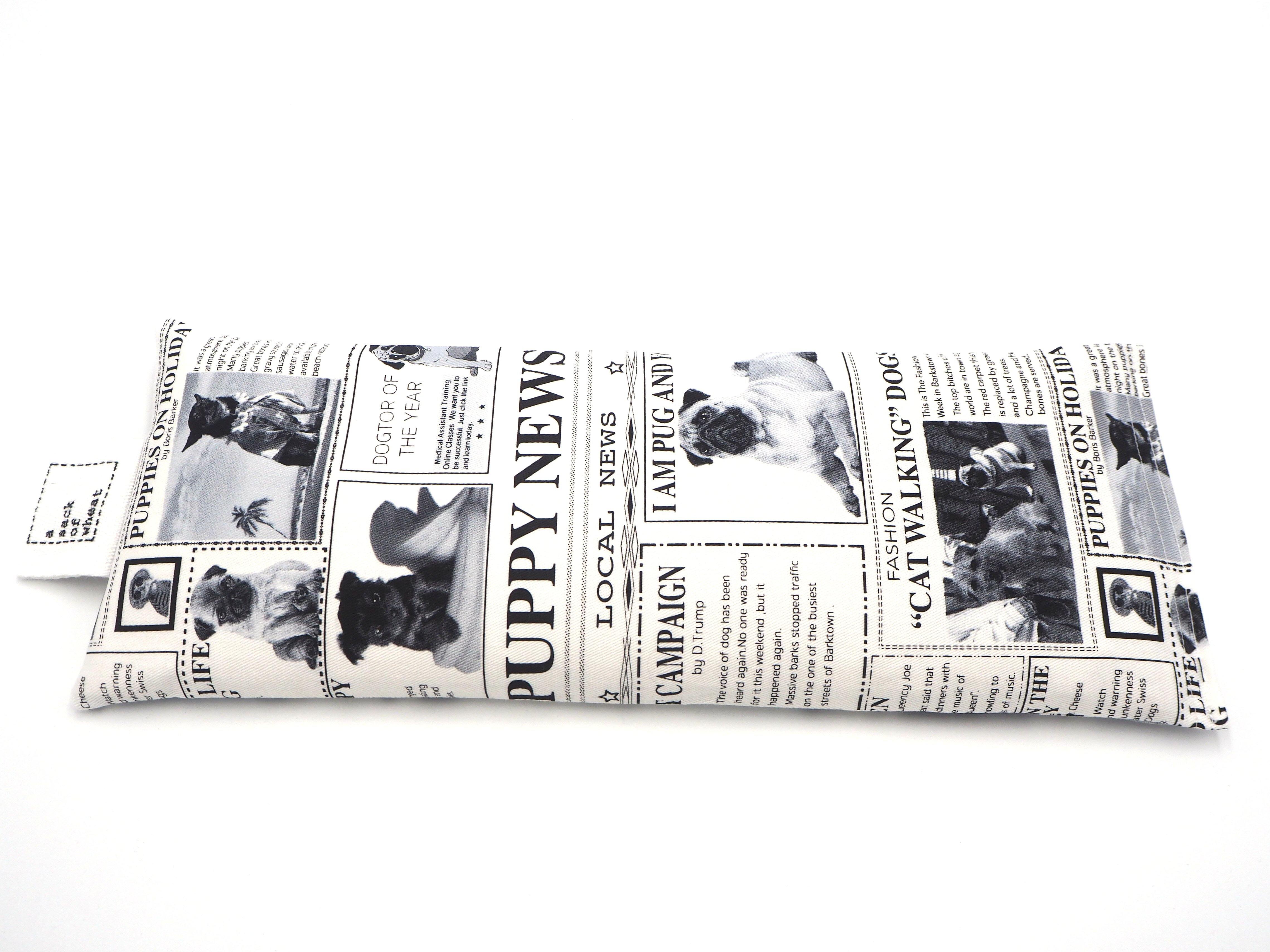 Flat view of A Sack Of Wheat, made from the Black & white news print featuring "All the News!" on Pugs & Puppy's. 100% cotton fabric