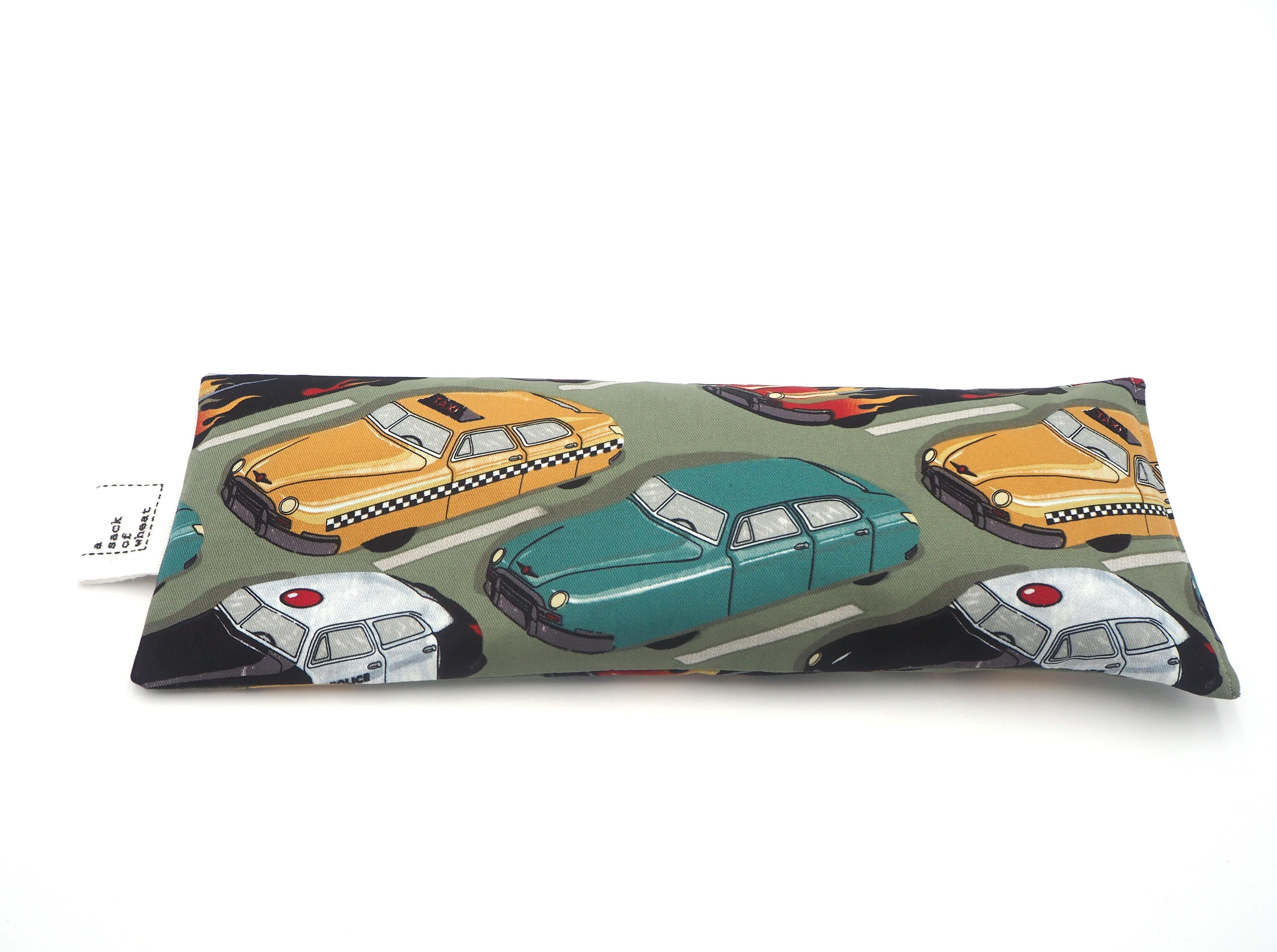 Flat view of A Sack Of Wheat, featuring vintage Taxi's, Sedan's & Police Cars, stuck in traffic print, 100% cotton fabric