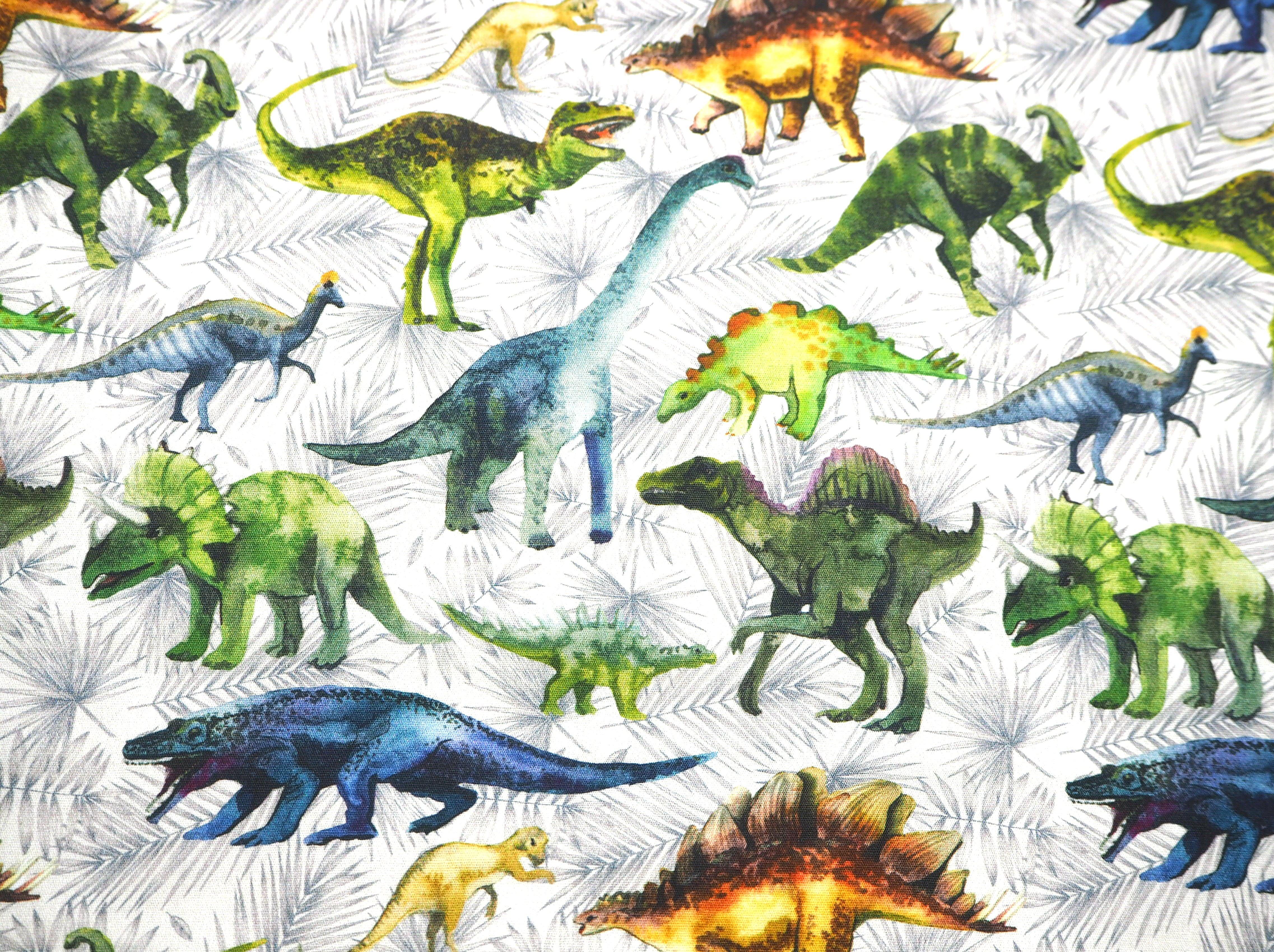 Colorful prehistoric Dinosaur images on light grey background, 100% cotton fabric