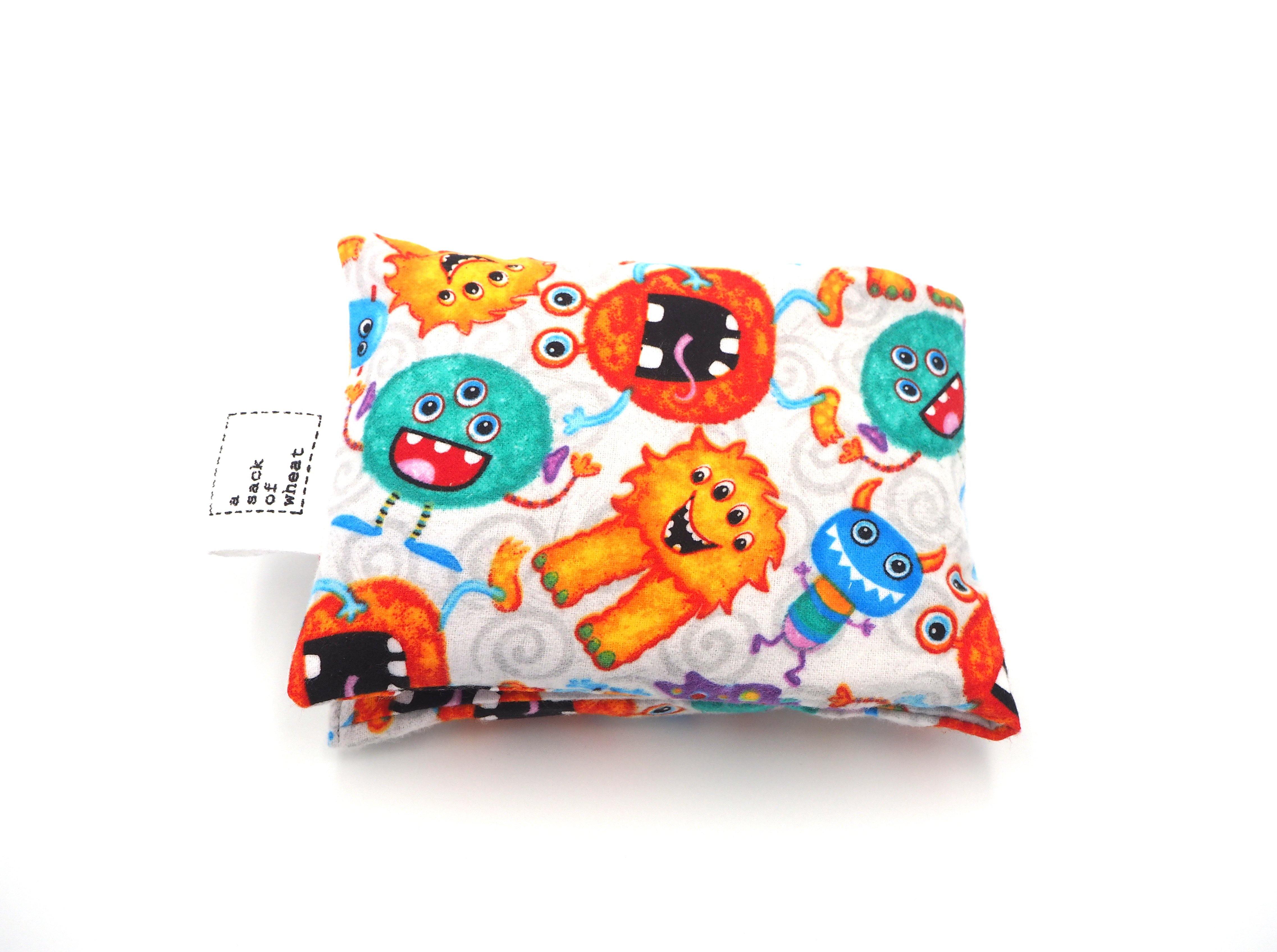 Folded view of A Sack Of Wheat, featuring a colorful, friendly bunch of Monsters on fluffy, soft 100% cotton flannelette fabric